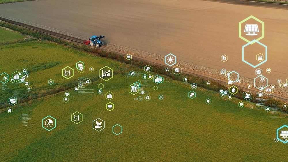 Aerial view of a tractor plowing a field with Ag Tech/Cooperative Ventures icons overlaid.